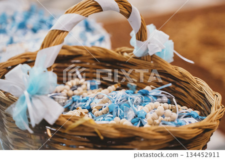 Basket with Blue and White Baptism Favors Displayed Basket with Blue and White Baptism Favors Displayed 134452911