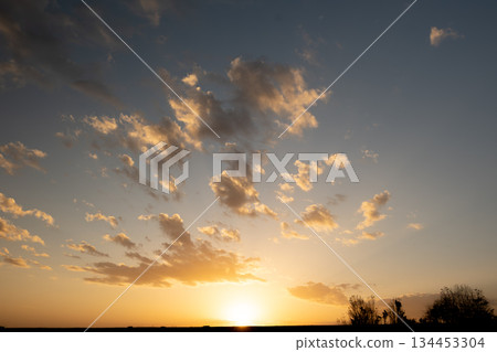 A sunset landscape with vast gradations and light A sunset landscape with vast gradations and light 134453304