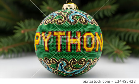 Python programming language Christmas ornament on a festive fir tree branch Python programming language Christmas ornament on a festive fir tree branch 134453428