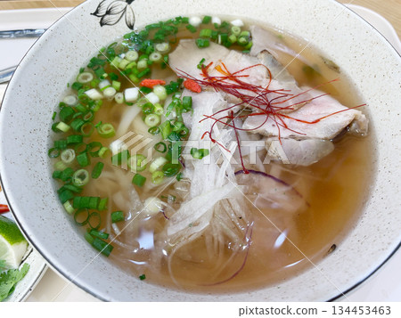 Vietnamese pho with pork: A mild and flavorful rice noodle soup. 134453463