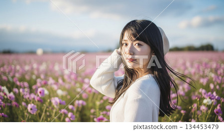A woman going out to a cosmos field in autumn A woman going out to a cosmos field in autumn 134453479