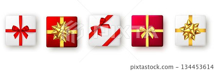 Festive Christmas gift boxes wrapped in red, white, and gold 134453614