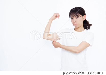 A woman who cares about slack in her upper arm A woman who cares about slack in her upper arm 134454011
