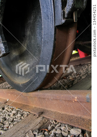 Close-up of old railway wheel and tyre. Old transportation concept. Close-up of old railway wheel and tyre. Old transportation concept. 134454251