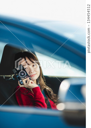 A young woman driving a car A young woman driving a car 134454512