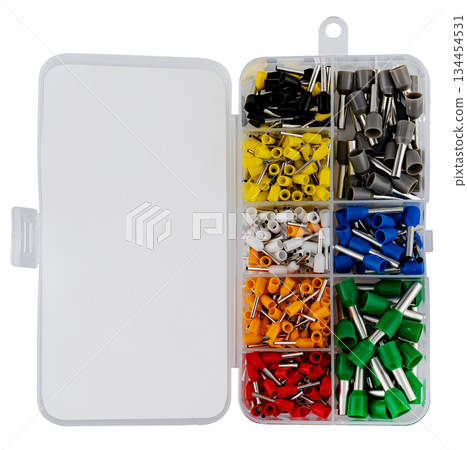 Set of metal wire connectors in a plastic container, on a white background in insulation Set of metal wire connectors in a plastic container, on a white background in insulation 134454531