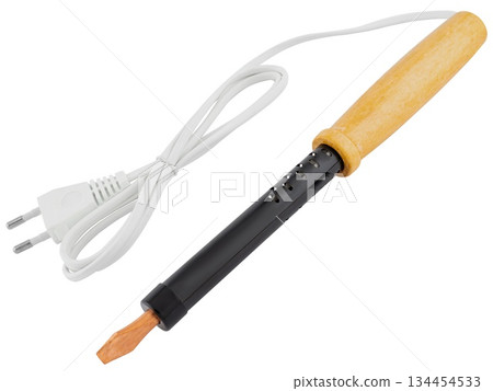 Powerful soldering iron with wooden handle and thick tip, on a white background in insulation Powerful soldering iron with wooden handle and thick tip, on a white background in insulation 134454533