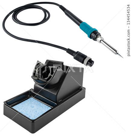 Soldering iron with stand, designed for precise soldering of electronic components. Soldering iron with stand, designed for precise soldering of electronic components. 134454534