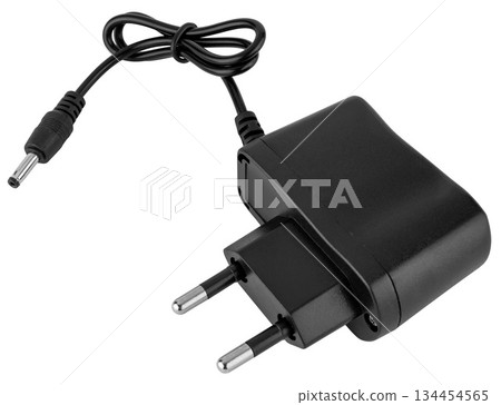 Compact power adapter for stable charging of electronic devices and gadgets. On a white background 134454565