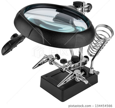 Desktop magnifying glass with clamps for working with electronics. On a white background 134454566