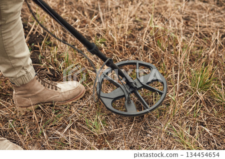 Sensitive sensor, searching. Man is with metal detector in the field Sensitive sensor, searching. Man is with metal detector in the field 134454654