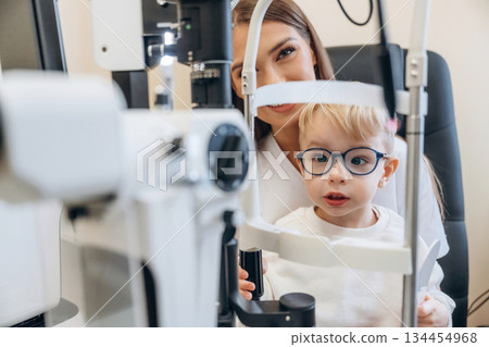In the ophthalmologist cabinet. Little boy is having check up 134454968
