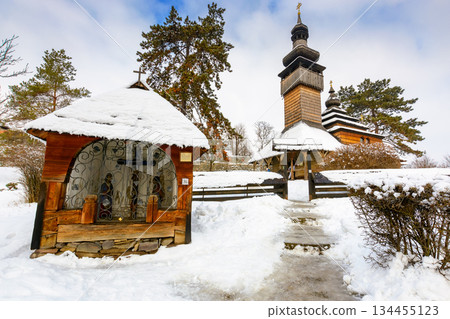uzhhorod, ukraine - 15 jan 2017: old wooden church of archangel michael in open air museum of folk and architecture in winter. traditional wooden architecture of transcarpathia. heritage of ukraine 134455123