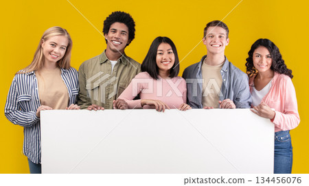 Education, ad and student recommendations. Diverse teens cheerful international students holding big banner with free space and ready to study at college, isolated on beige background, studio shot Education, ad and student recommendations. Diverse teens cheerful international students holding big banner with free space and ready to study at college, isolated on beige background, studio shot 134456076