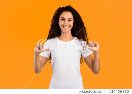 Look At Me. Happy Lady Pointing Fingers Thumbs At Herself Posing Standing On Yellow Background, Smiling To Camera. Studio Shot. Choose Me. Self-Confidence Concept. Panorama Look At Me. Happy Lady Pointing Fingers Thumbs At Herself Posing Standing On Yellow Background, Smiling To Camera. Studio Shot. Choose Me. Self-Confidence Concept. Panorama 134456510