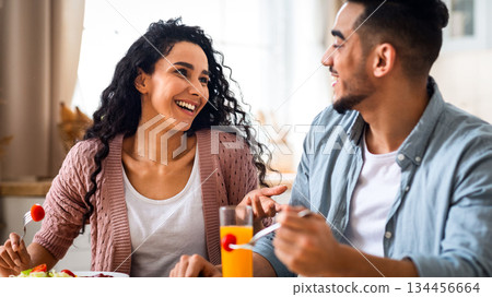 Morning Meal. Romantic Arab Couple Eating Breakfast, Chatting And Laughing In Kitchen, Happy Millennial Middle Eastern Spouses Enjoying Tasty Food, Having Fun At Home Together, Closeup Shot 134456664