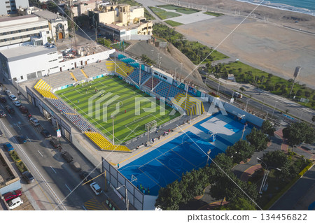 Aerial view sports complex with soccer field along coast Aerial view sports complex with soccer field along coast 134456822