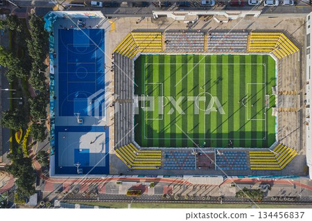 Aerial view urban sports complex with soccer field and basketball courts 134456837