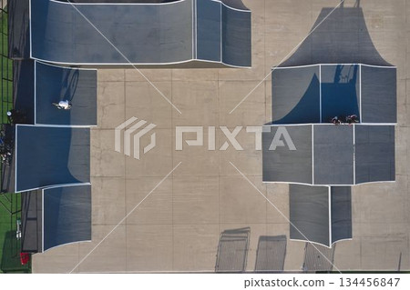 Aerial view of skate park with bmx riders 134456847