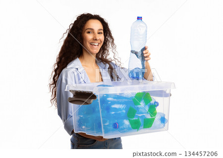 Happy Woman Putting Used Plastic Bottle To Box With Recycle Symbol Posing Standing On White Background. Studio Shot. Plastic Litter Sorting And Disposal, Waste Recycling Concept 134457206