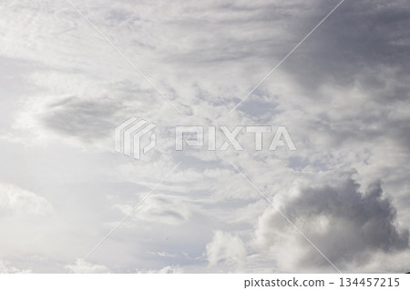 Dynamic Cloud Formations in a Bright Sky. Weather Atmosphere. Cloudy Sky. Nature and Climate Background. High quality photo Dynamic Cloud Formations in a Bright Sky. Weather Atmosphere. Cloudy Sky. Nature and Climate Background. High quality photo 134457215