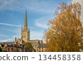 Norwich, Norfolk, UK:  Norwich Cathedral with spire seen from The Close to the southern side of the cathedral. 134458358