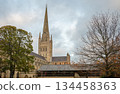 Norwich, Norfolk, UK:  Norwich Cathedral with spire seen from The Close to the western side of the cathedral. 134458363