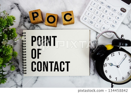 POC Point Of Contact text with calculator and alarm clock on marble background POC Point Of Contact text with calculator and alarm clock on marble background 134458842