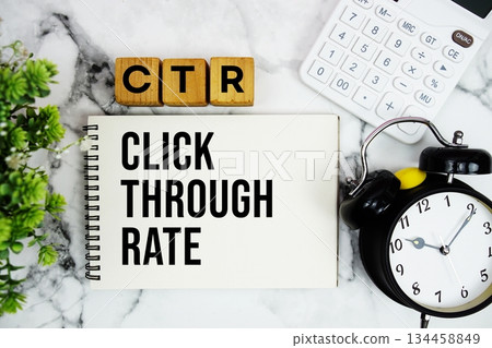 CTR Click Through Rate text with calculator and alarm clock on marble background CTR Click Through Rate text with calculator and alarm clock on marble background 134458849