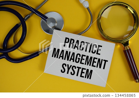 Practice Management System (PMS) text on paper card with Stethoscope and magnifying glass flat lay on yellow background Practice Management System (PMS) text on paper card with Stethoscope and magnifying glass flat lay on yellow background 134458865