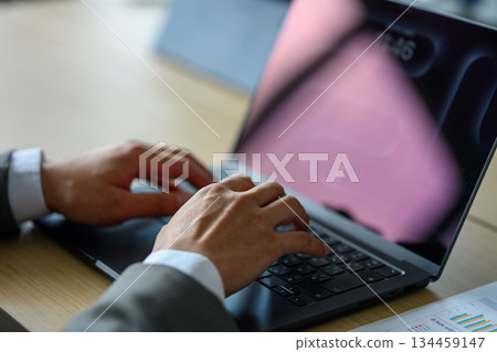 Hands of a businessman working on a laptop 134459147