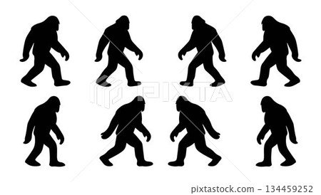 Bundle silhouettes of walking Bigfoot creatures vector objects in black on a white background 134459252