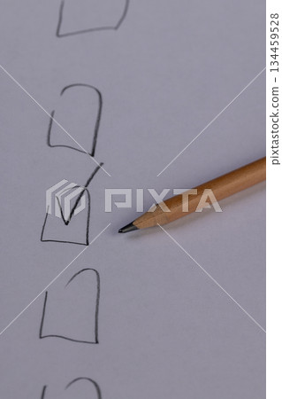 a primitive pencil drawing, squares for choosing an option drawn on cheap thin paper with a pencil with a black lead 134459528