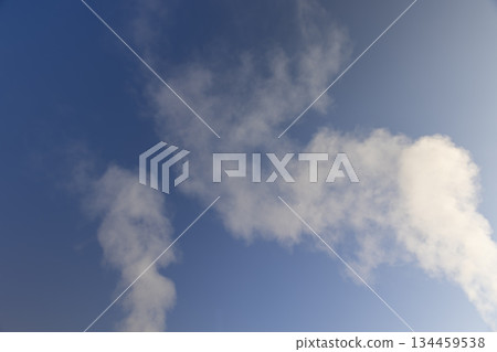 white smoke coming from a wide pipe against a blue sky background, white steam coming from a pipe during heating of a large industrial premises white smoke coming from a wide pipe against a blue sky background, white steam coming from a pipe during heating of a large industrial premises 134459538