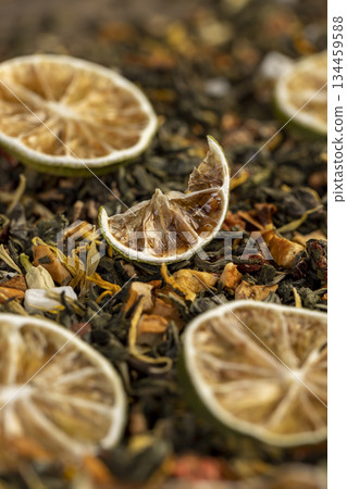 natural green tea with added flavors of fruit and cut dried green limes , bright large dry lime slices and green tea with pieces of fruit natural green tea with added flavors of fruit and cut dried green limes , bright large dry lime slices and green tea with pieces of fruit 134459588