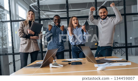 Amazing success, happy. Professional workers are in the modern office together 134459807