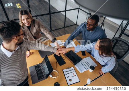 Supporting each other, team is together. Professional workers are in the modern office Supporting each other, team is together. Professional workers are in the modern office 134459830