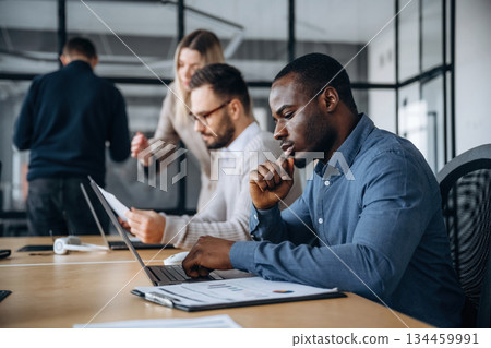 Colleagues are together. Professional workers are in the modern office Colleagues are together. Professional workers are in the modern office 134459991