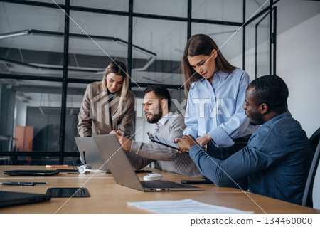 Colleagues are together. Professional workers are in the modern office Colleagues are together. Professional workers are in the modern office 134460000