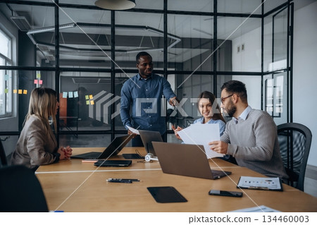 Business conception. Professional workers are in the modern office together 134460003
