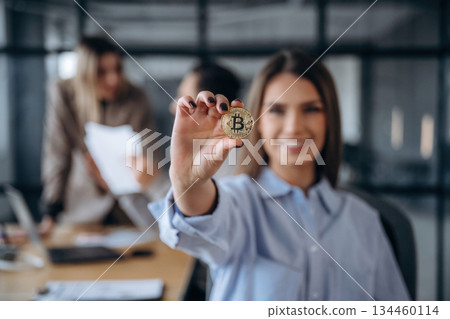 Trading and crypto currency conception. Professional workers are in the modern office together Trading and crypto currency conception. Professional workers are in the modern office together 134460114