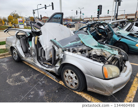 Chicago, USA - November 11, 2024: Broken Cadillac DeVille, angle view. 2003 Cadillac DeVille crashed in car accident. Cadillac car crash and damage. Damage of car in accident. Car crash insurance 134460498