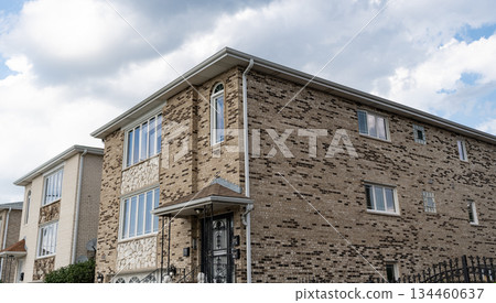 Cozy suburban house. Architecture concept. Home in suburb. Residential house. Suburban home in neighborhood. Private residential architecture dwelling. Suburban house architecture. Luxurious living 134460637