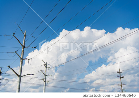 Electric voltage station. High voltage. Electricity power pylon. Electricity tower. Electrical energy. Power transmission tower. Electrical grid. Electricity power lines and sky. Green energy 134460640