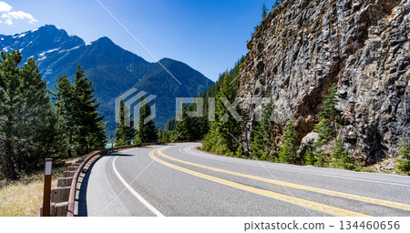 North Cascades nation park. Road leads to Diablo lake with mountain landscape. Landscape of mountain and road. Travel destination. Landscape route to North Cascades National Park. Scenic nature North Cascades nation park. Road leads to Diablo lake with mountain landscape. Landscape of mountain and road. Travel destination. Landscape route to North Cascades National Park. Scenic nature 134460656