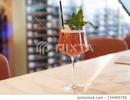 Cocktail in bar. Lemonade drink in glass. Copy space. Cocktail drink. Aperitif in the bar. Summer refreshing cocktail. Drinking alcohol beverage. Glass of cocktail aperitif beverage. Summer drink Cocktail in bar. Lemonade drink in glass. Copy space. Cocktail drink. Aperitif in the bar. Summer refreshing cocktail. Drinking alcohol beverage. Glass of cocktail aperitif beverage. Summer drink 134460788