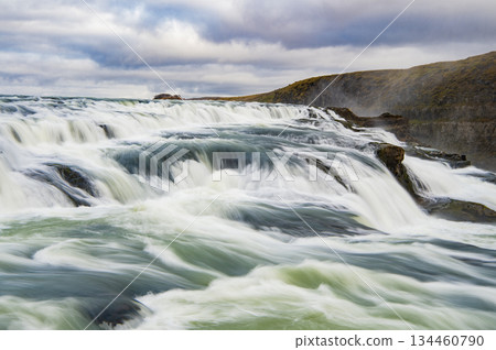 Gullfoss waterfall nature. Waterfall river cascade. Iceland nature river flow. Picturesque Gullfoss waterfall creek. Nature wildness. River flow cascade. Waterfall creek flow Gullfoss waterfall nature. Waterfall river cascade. Iceland nature river flow. Picturesque Gullfoss waterfall creek. Nature wildness. River flow cascade. Waterfall creek flow 134460790
