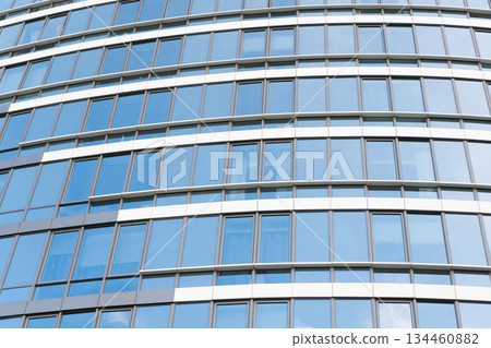 Building exterior architecture. Building background. Glass building windows. Architectural detail. Background of architecture structure. Modern urban backdrop. Glass exterior background. Architecture Building exterior architecture. Building background. Glass building windows. Architectural detail. Background of architecture structure. Modern urban backdrop. Glass exterior background. Architecture 134460882