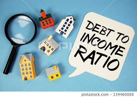 DTI Debt To Income Ratio text with house models on blue background DTI Debt To Income Ratio text with house models on blue background 134460888