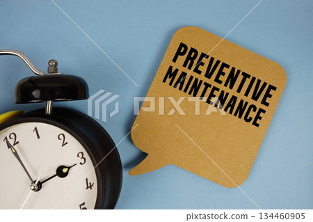Preventive Maintenance text with alarm clock on blue background Preventive Maintenance text with alarm clock on blue background 134460905